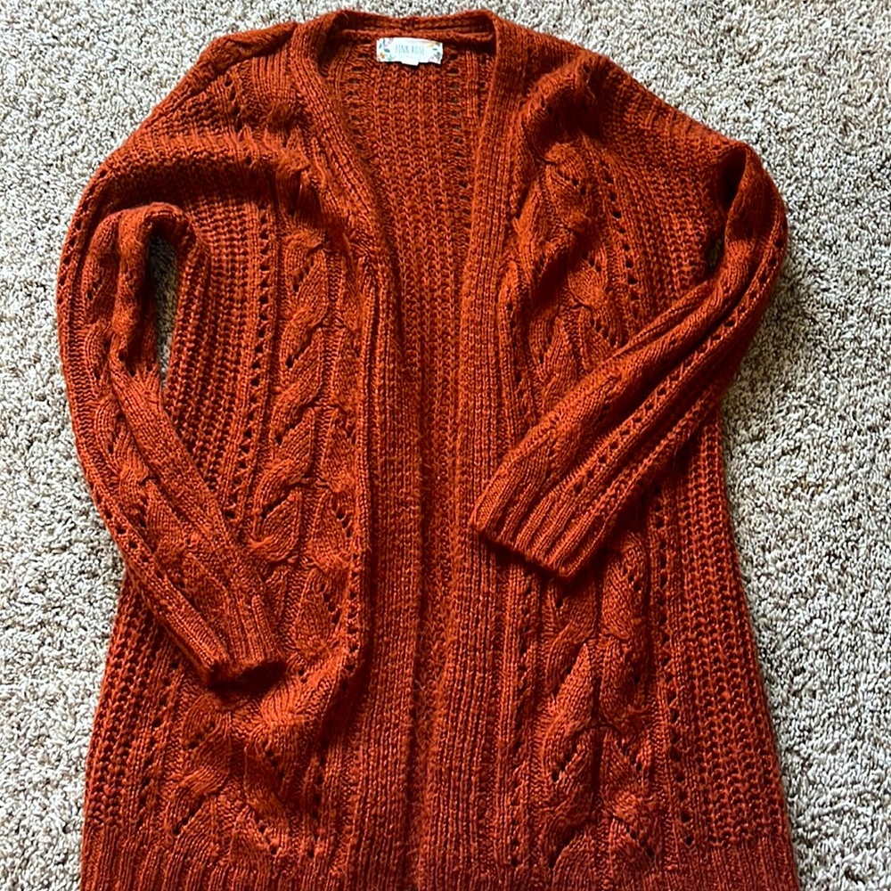 Pink Rose cardigan . A dark orange color